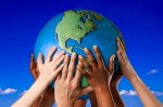 Hands on a globe --- Image by © Royalty-Free/Corbis